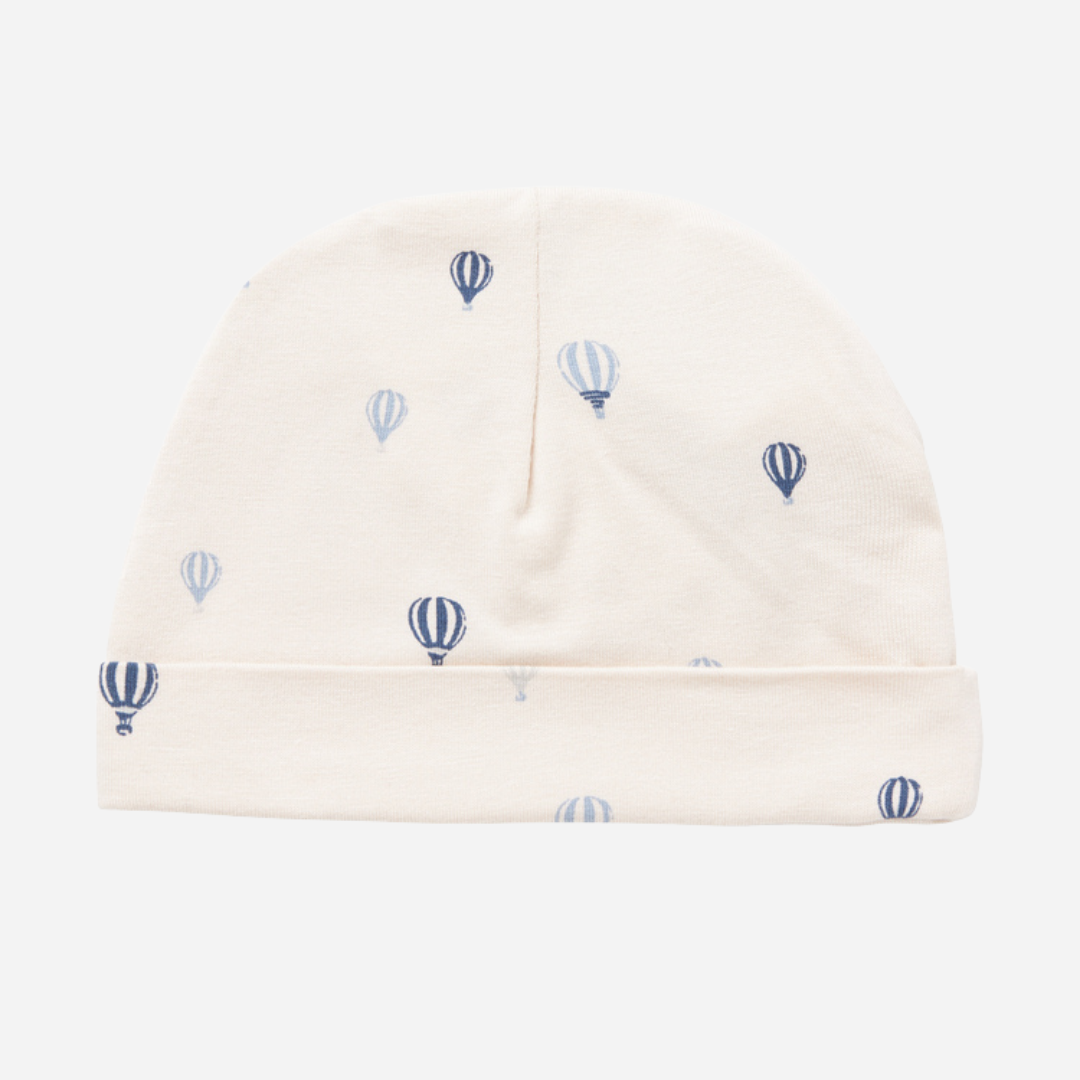 Sold at Bombon shop, designed by MarMar Copenhagen. Cream baby blanket with blue air balloon print, pairs perfectly with the matching air balloon hat and wrap footie.