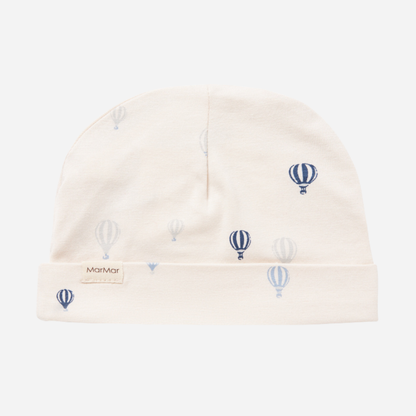 Sold at Bombon shop, designed by MarMar Copenhagen. Cream baby blanket with blue air balloon print, pairs perfectly with the matching air balloon hat and wrap footie.