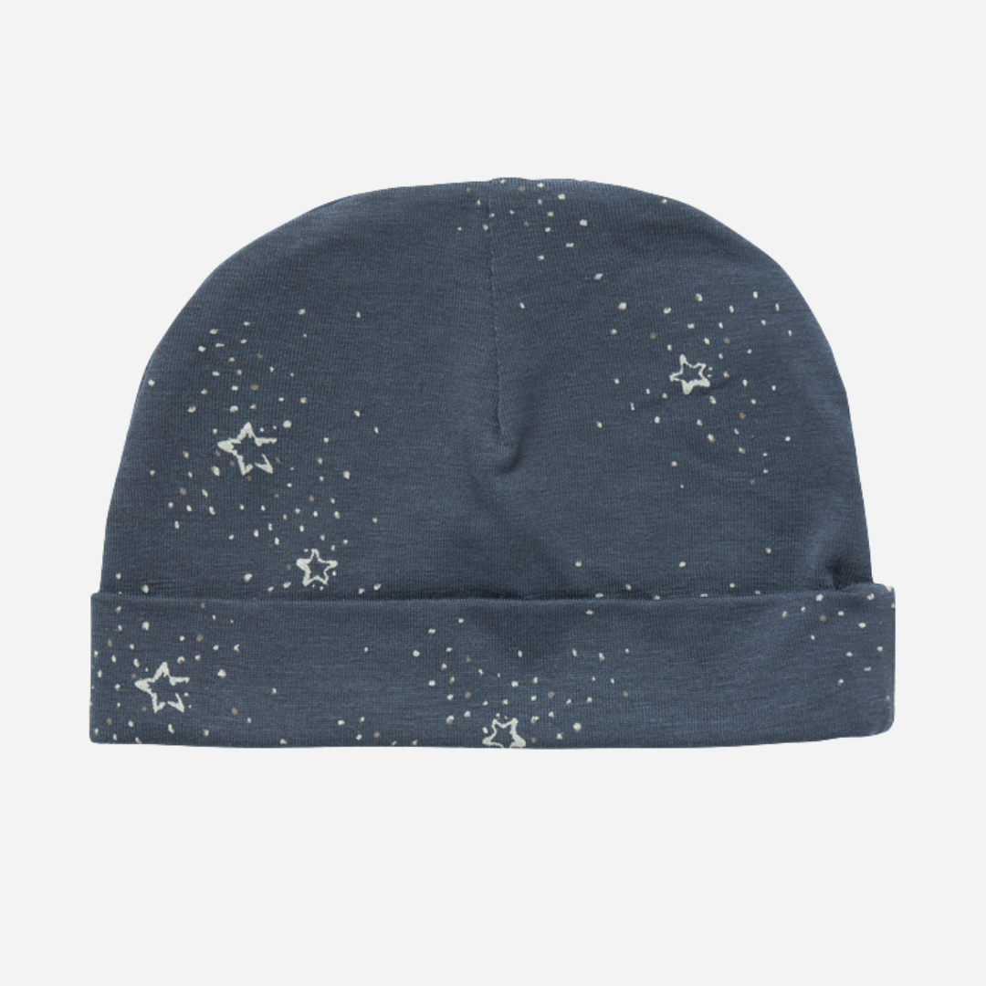 Sold at Bombon shop, designed by MarMar Copenhagen. Midnight blue baby hat with white star print, pairs perfectly with the matching wrap footie and blanket.