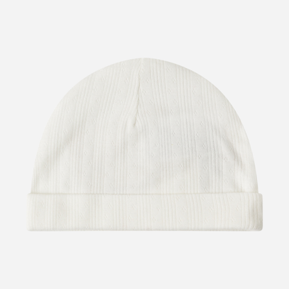 Sold at Bombon shop, designed by MarMar Copenhagen. Cream white ribbed baby hat, pairs perfectly with the matching wrap footie and blanket.