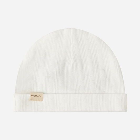 Sold at Bombon shop, designed by MarMar Copenhagen. Cream white ribbed baby hat, pairs perfectly with the matching wrap footie and blanket.