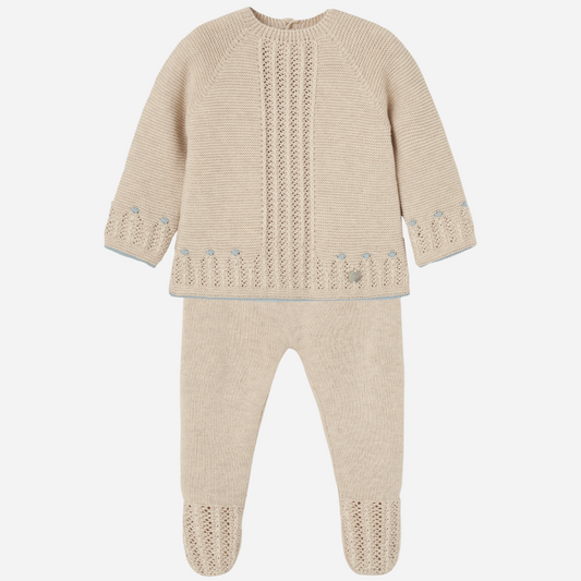 Sold at Bombon shop, designed by Paz Rodriguez. Beige baby knit set for boys with blue accents and footed pants, featuring openwork detail on the top.