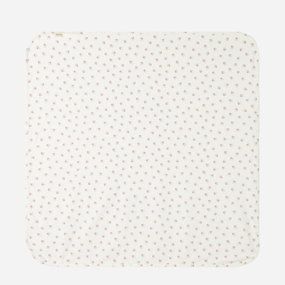 Sold at Bombon shop, designed by MarMar Copenhagen — white organic cotton baby blanket with floral print, part of a matching set.