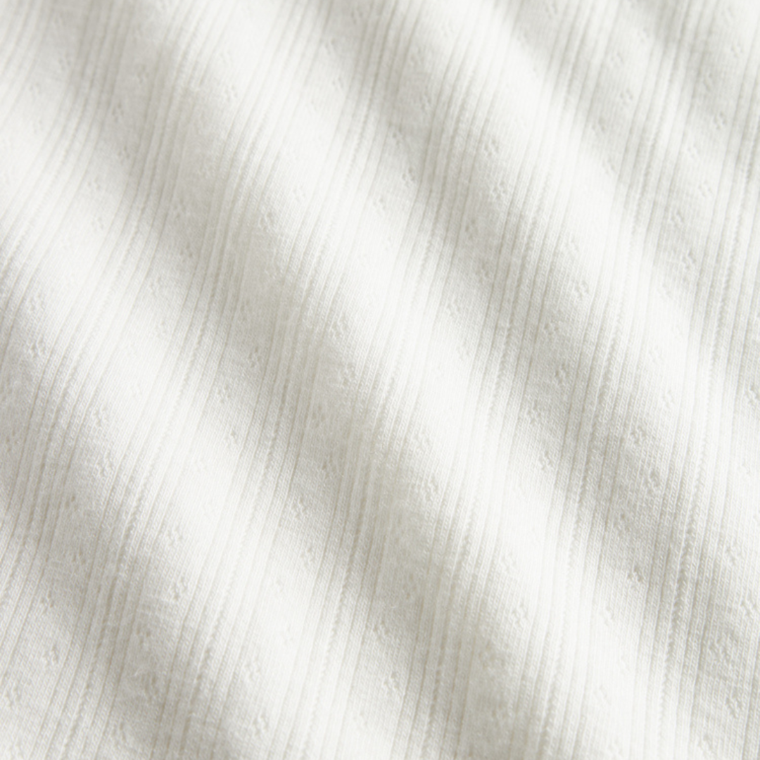 Sold at Bombon shop, designed by MarMar Copenhagen. Cream white ribbed baby blanket, pairs perfectly with the matching wrap footie and hat