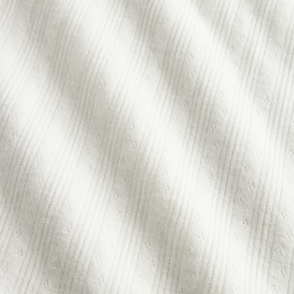 Sold at Bombon shop, designed by MarMar Copenhagen. Cream white ribbed baby blanket, pairs perfectly with the matching wrap footie and hat