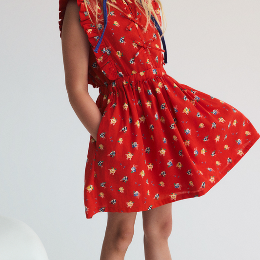 sold at Bombon, designed by The New Society red amapola floral girls dress in 100% organic cotton with sleeveless silhouette matching sibling set