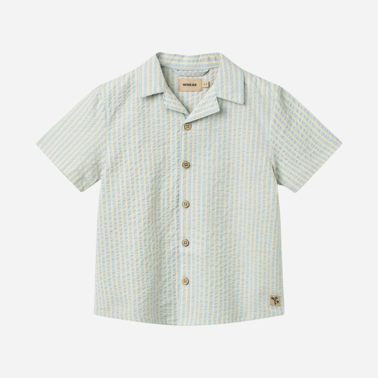 Sold at Bombon Shop, designed by Wheat, summer sky stripe organic cotton short sleeve button-down shirt with soft blue vertical stripes.
