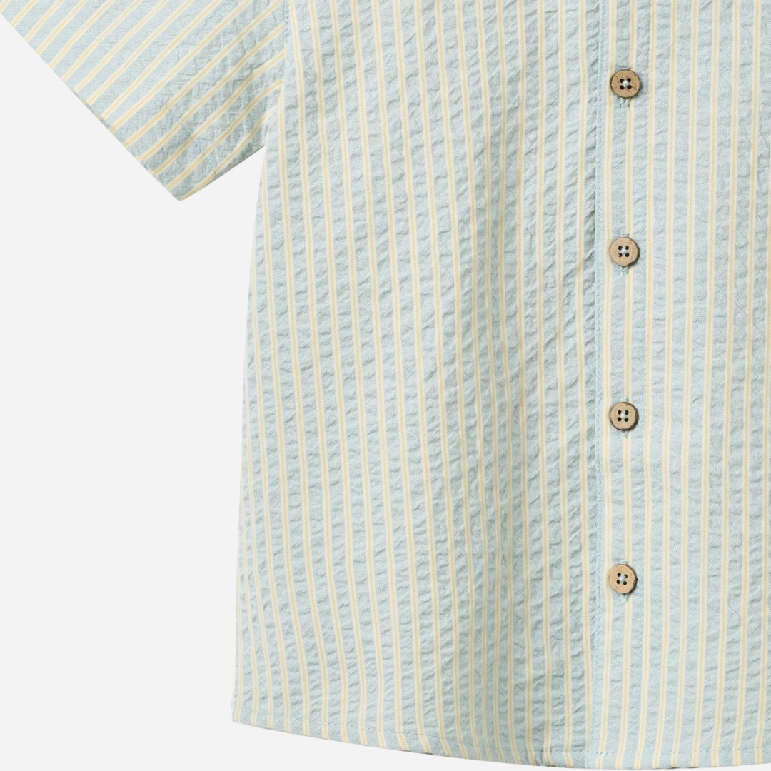 Sold at Bombon Shop, designed by Wheat, summer sky stripe organic cotton short sleeve button-down shirt with soft blue vertical stripes.