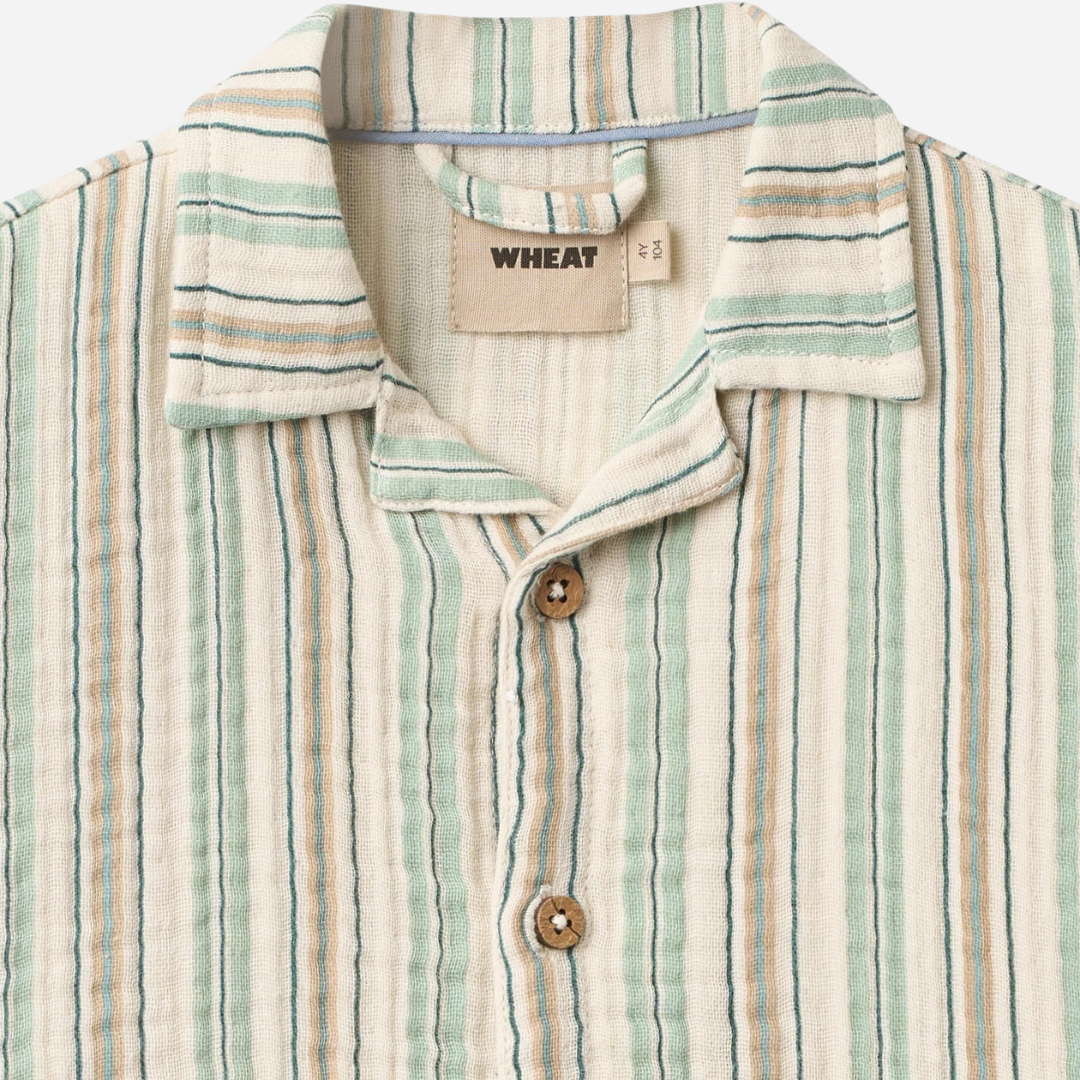 Sold at Bombon Shop, designed by Wheat, summer sky stripe organic cotton short sleeve kids button-down shirt with vertical striped pattern.