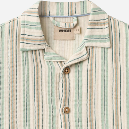 Sold at Bombon Shop, designed by Wheat, summer sky stripe organic cotton short sleeve kids button-down shirt with vertical striped pattern.