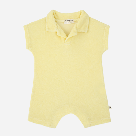 Sold at Bombon Shop, designed by 1+ in the family, lemon baby romper with soft cotton fabric and polo-style collar.