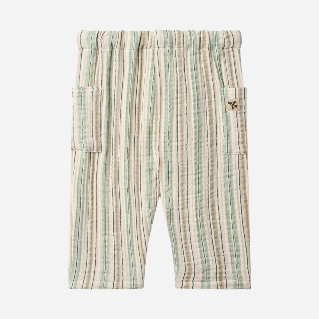 Sold at Bombon Shop, designed by Wheat, summer stripe organic cotton baby trousers with elastic waistband and vertical striped pattern.