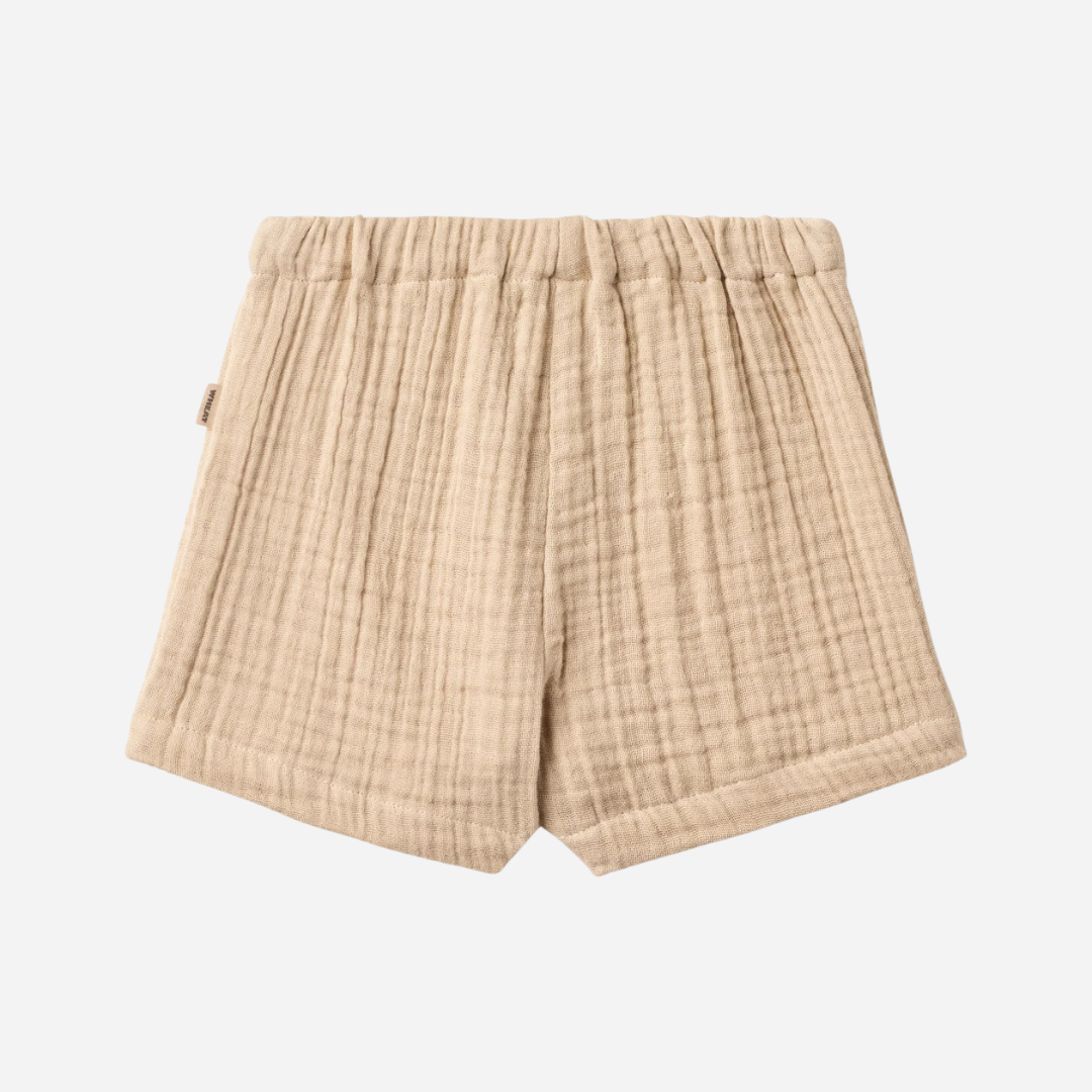 Sold at Bombon Shop, designed by Wheat, warm sand organic cotton kids shorts with subtle vertical stripes and elastic waistband.