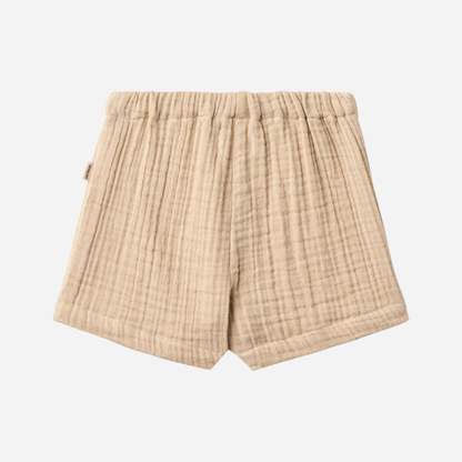 Sold at Bombon Shop, designed by Wheat, warm sand organic cotton kids shorts with subtle vertical stripes and elastic waistband.