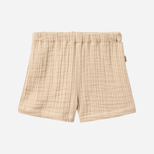 Sold at Bombon Shop, designed by Wheat, warm sand organic cotton kids shorts with subtle vertical stripes and elastic waistband.
