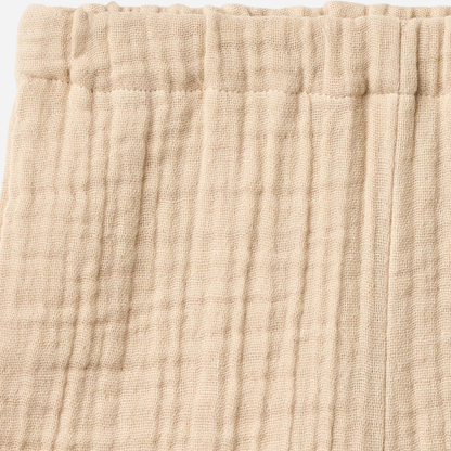 Sold at Bombon Shop, designed by Wheat, warm sand organic cotton kids shorts with subtle vertical stripes and elastic waistband.