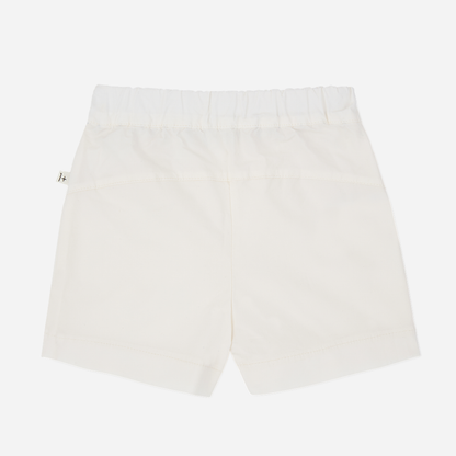 Sold at Bombon Shop, designed by 1+ in the family, off-white baby bermuda shorts with front button detail and soft cotton fabric.