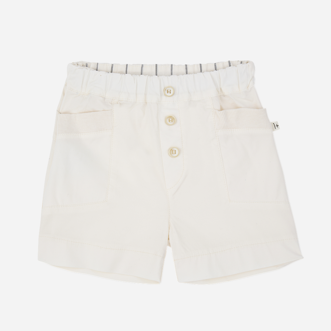 Sold at Bombon Shop, designed by 1+ in the family, off-white baby bermuda shorts with front button detail and soft cotton fabric.