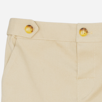 Sold at Bombon shop, designed by Fina Ejerique, beige twill baby trousers with waistband button details and side pockets. zoom