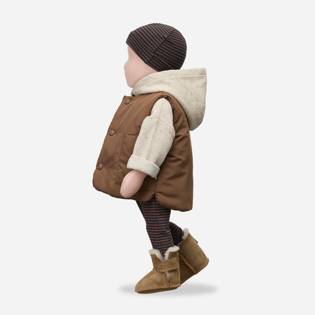 Sold at Bombon shop, designed by 1+ in the family — oatmeal-colored speckled baby hoodie with wooden button and rolled cuffs, photographed flat on white background. mannequin