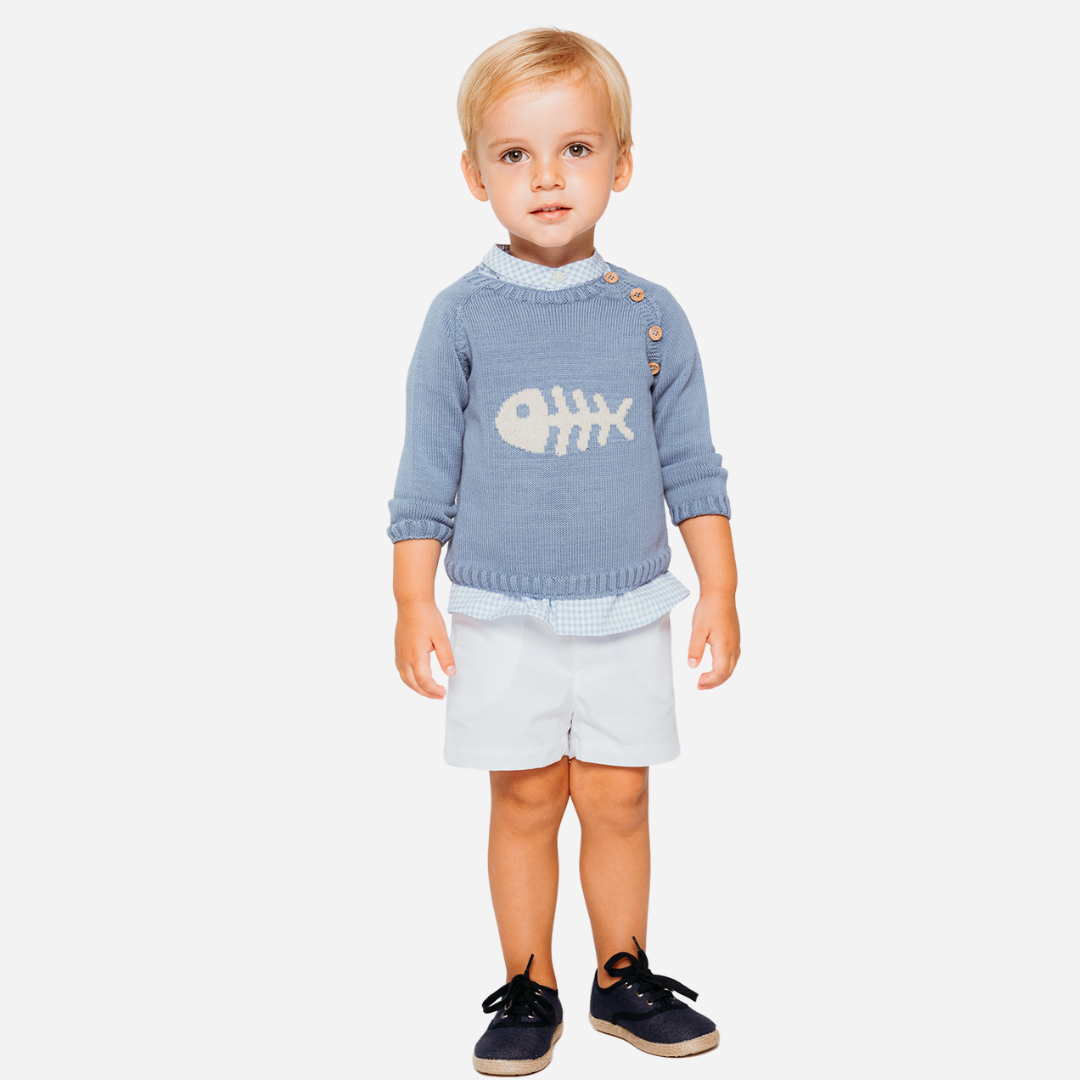 Sold at Bombon, designed by Fina Ejerique brand, a blue gingham shirt for babies and toddlers perfect for spring and summer. Model view 
