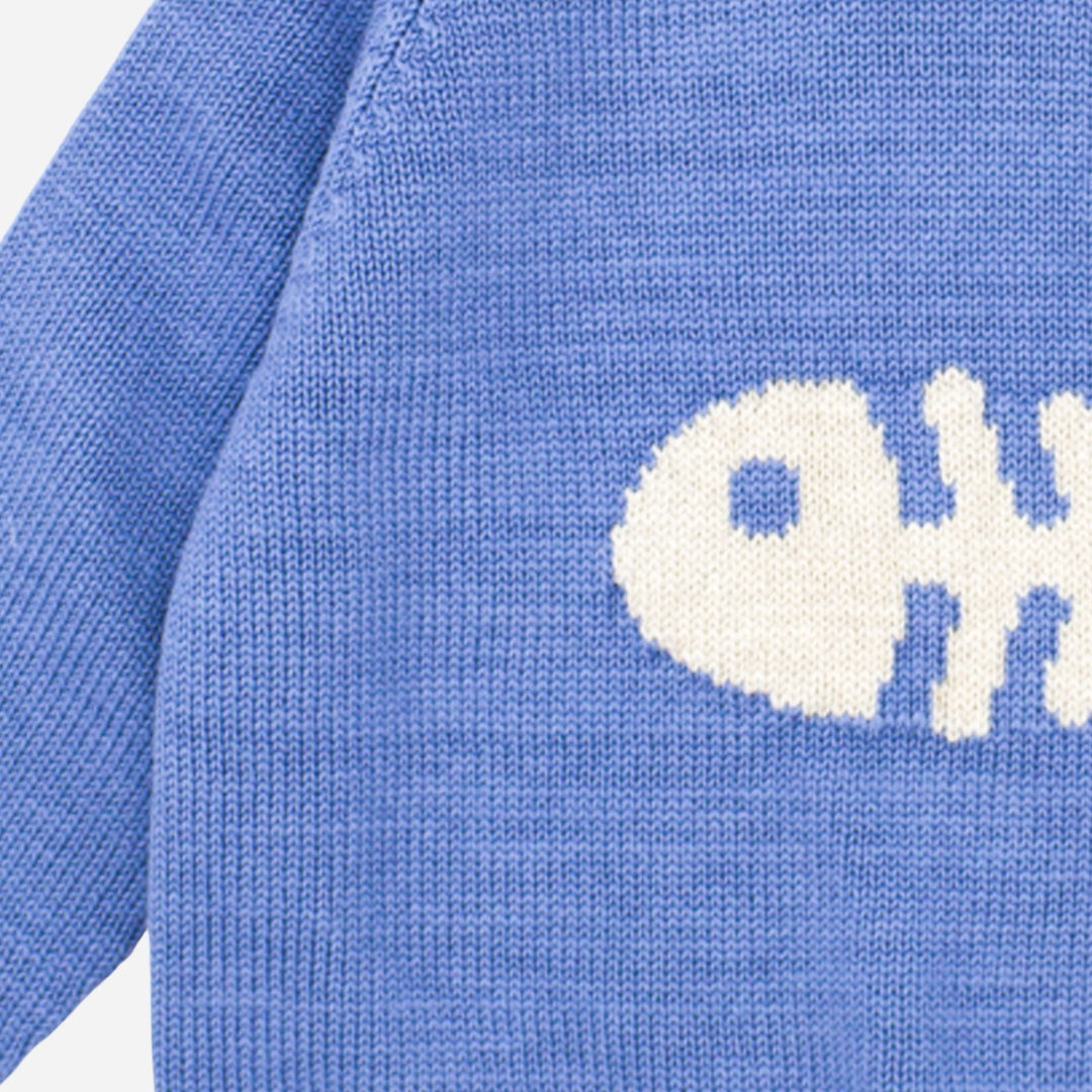 Sold at Bombon shop, designed by Fina Ejerique brand, a blue fish sweater for babies and toddlers perfect for spring and summer. Zoom view 