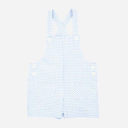 Sold at Bombon shop, designed by Fina Ejerique brand, blue gingham baby overalls perfect for spring and summer. Front view