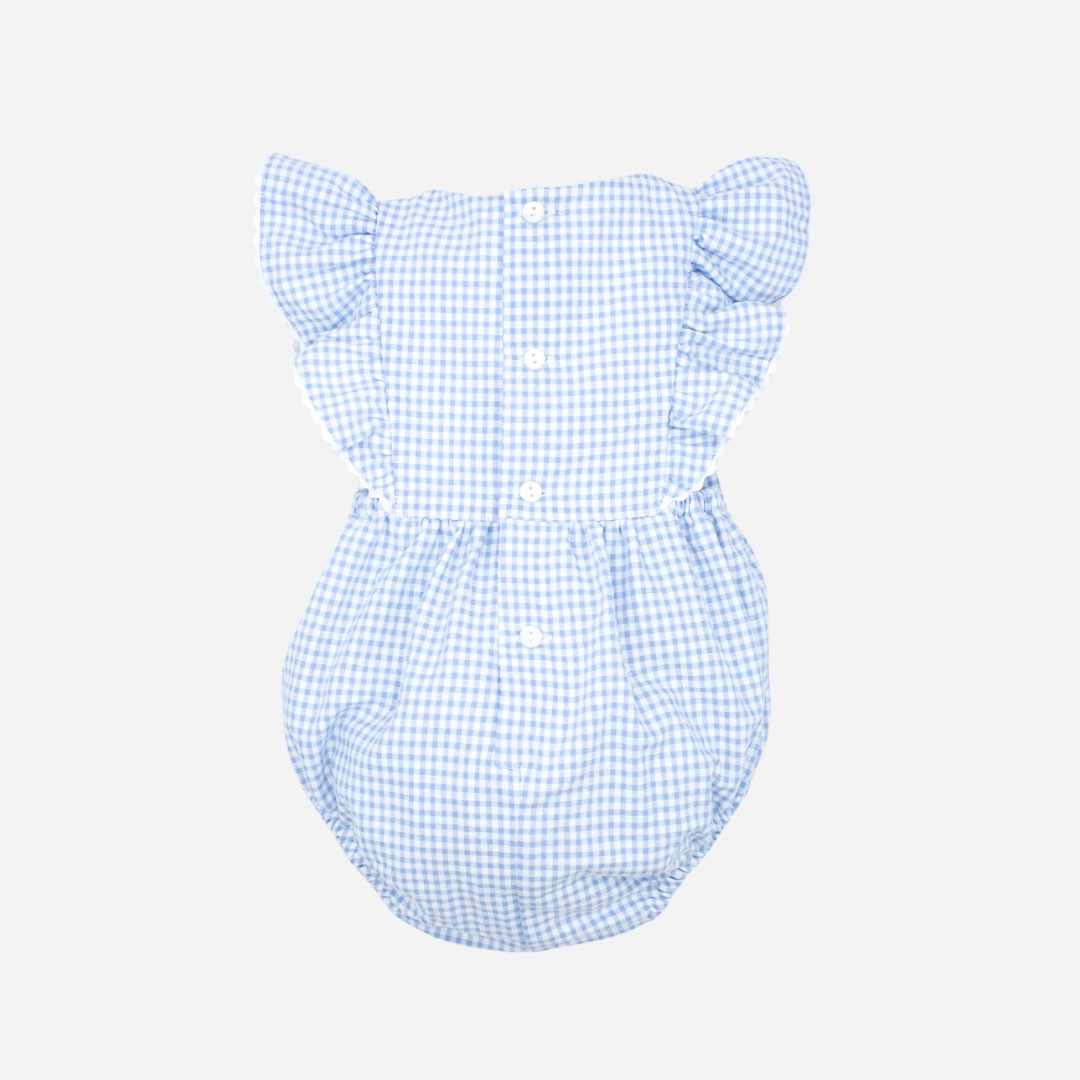 Sold in Bombon shop, designed by Fina Ejerique brand a gingham blue ruffle baby romper ideal for spring and summer. Back view
