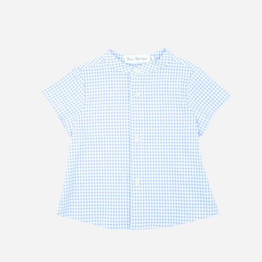 Sold at Bombon, designed by Fina Ejerique brand, a blue gingham shirt for babies and toddlers perfect for spring and summer. Front view 