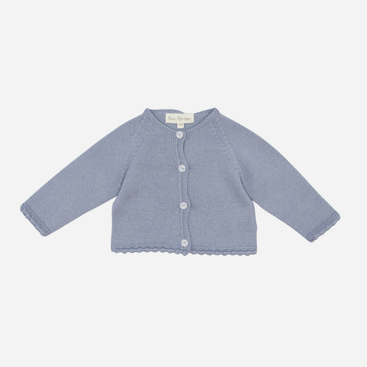 Sold at Bombon shop, designed by Fina Ejerique, a powder-blue knit baby cardigan with scalloped trim and front buttons. front