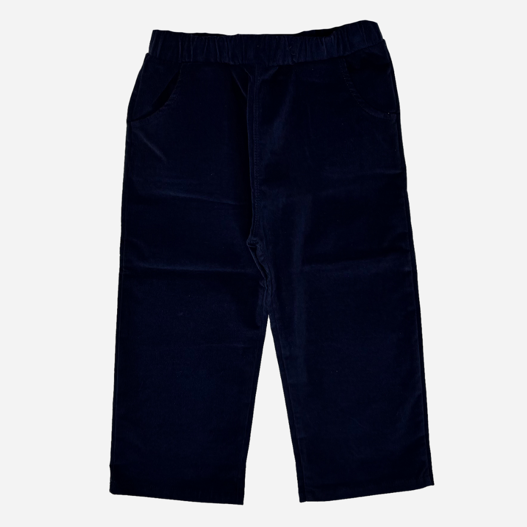 Sold at Bombon shop, designed by Tiny Soul — navy baby corduroy pants with wooden buttons and plaid-lined pockets. back