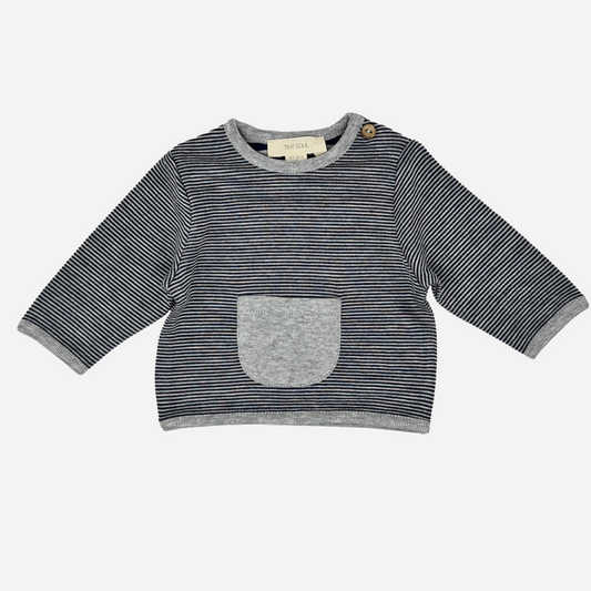 Sold at Bombon shop, designed by Tiny Soul — navy and ivory striped baby shirt with shoulder button and grey front pocket. front