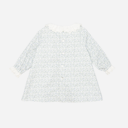 Sold at Bombon shop, designed by Fina Ejerique, a white floral viyella baby dress with smocked bodice, ruffle collar, and long sleeves. back
