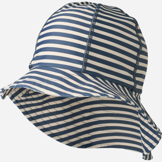 Sold at Bombon Shop, designed by Wheat, blue stripe UV sun hat in recycled fabric with soft brim and navy striped pattern.