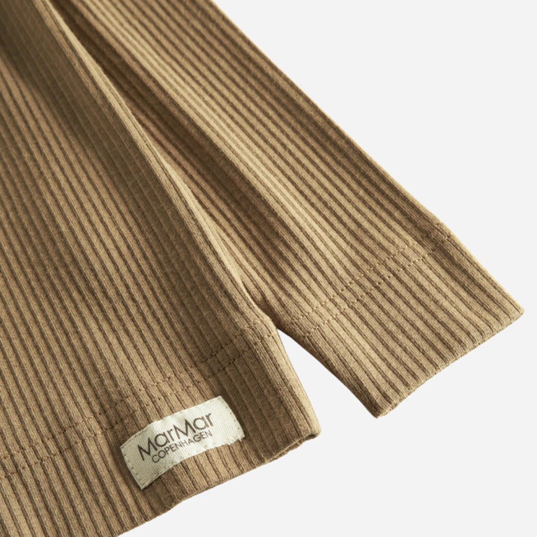 Sold at Bombon shop, designed by MarMar Copenhagen — caramel ribbed organic cotton long-sleeve baby top with buttoned neckline, part of a matching set.