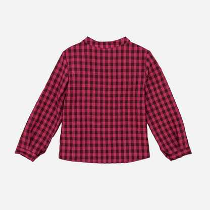 Sold at Bombon shop, designed by Fina Ejerique, a burgundy and black checkered cotton shirt with wooden buttons and long sleeves, styled to pair with the burgundy dog sweater.