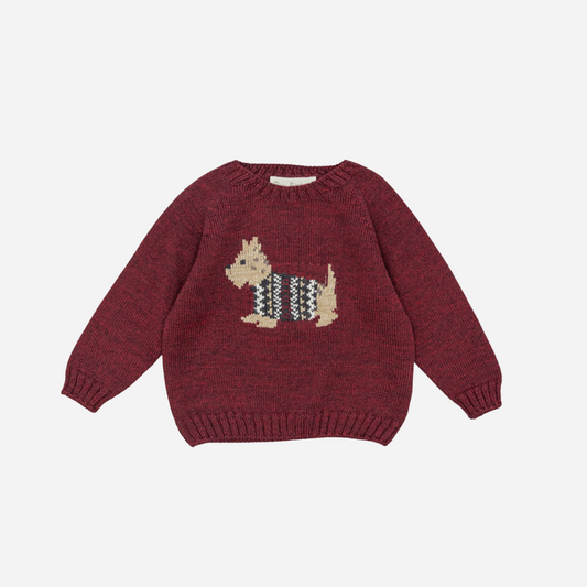 Sold at Bombon shop, designed by Fina Ejerique, a burgundy knit baby sweater with a dog motif in a houndstooth sweater.front