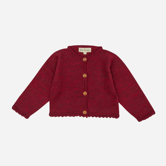 Sold at Bombon shop, designed by Fina Ejerique, a burgundy knit baby cardigan with wooden buttons and scalloped trim. front