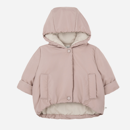 Sold at Bombon shop, designed by 1+ in the family — nude pink baby puffer jacket with cream lining, hood, snap closures, and front patch pockets, laid flat on white background. front