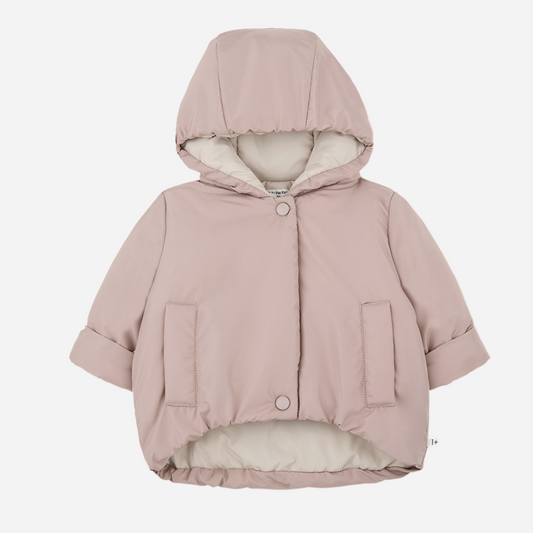 Sold at Bombon shop, designed by 1+ in the family — nude pink baby puffer jacket with cream lining, hood, snap closures, and front patch pockets, laid flat on white background. front