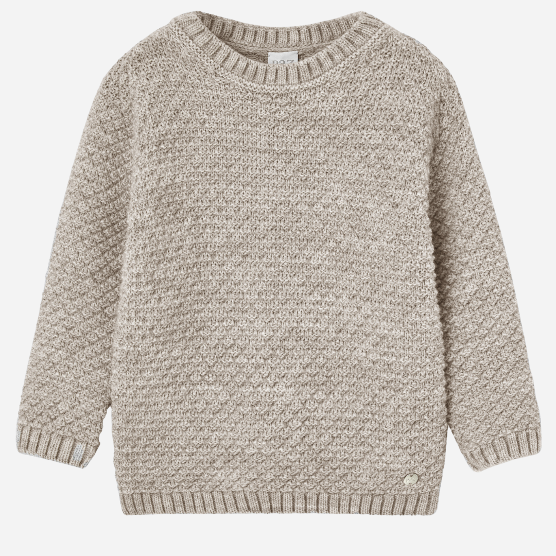 Sold at Bombon shop, designed by Paz Rodriguez, beige knit sweater with textured weave and ribbed collar, cuffs, and hem.