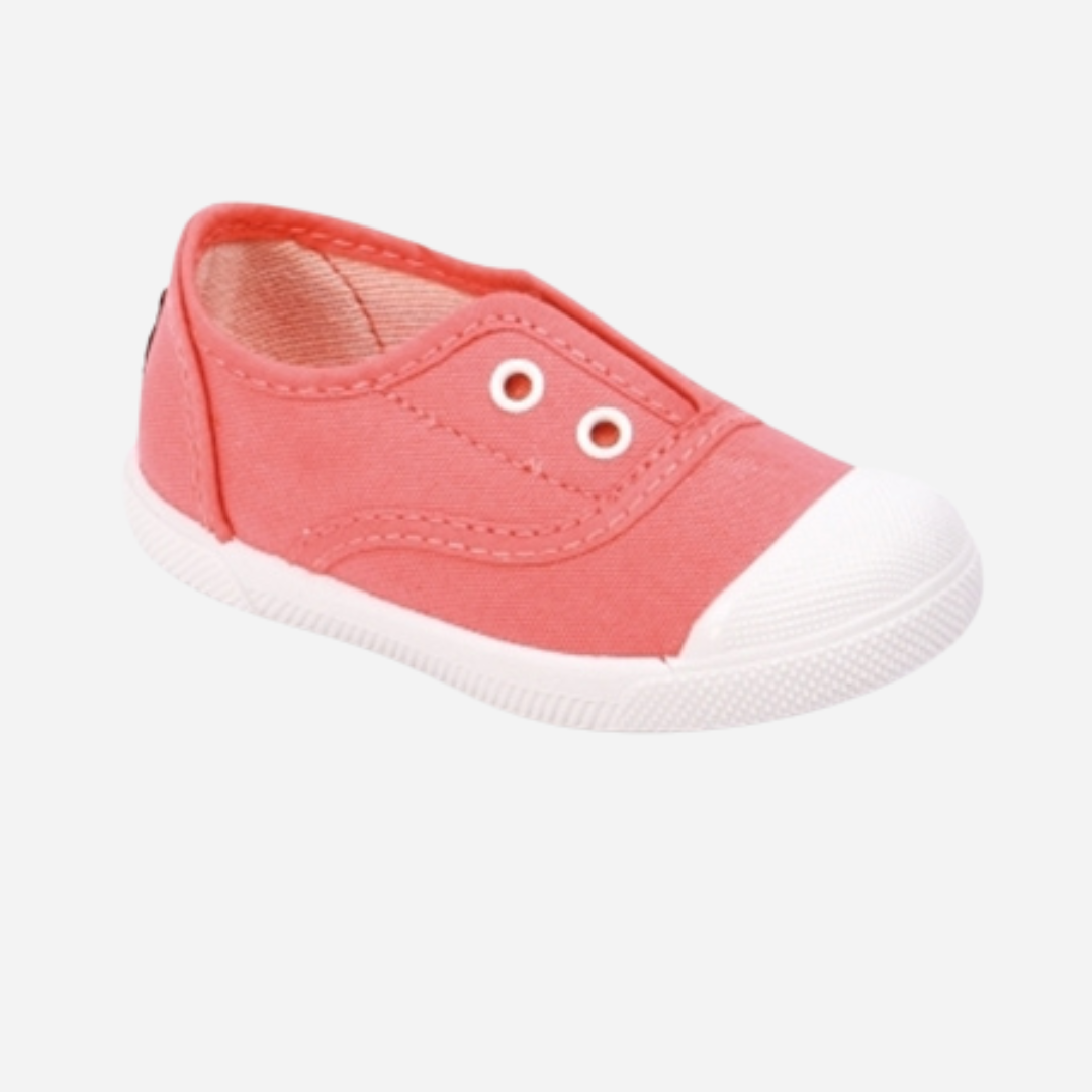 sold at Bombon shop. These canvas slip on sneakers in coral are designed for play and everyday wear with a white toecap and elasticated inner, without laces. 