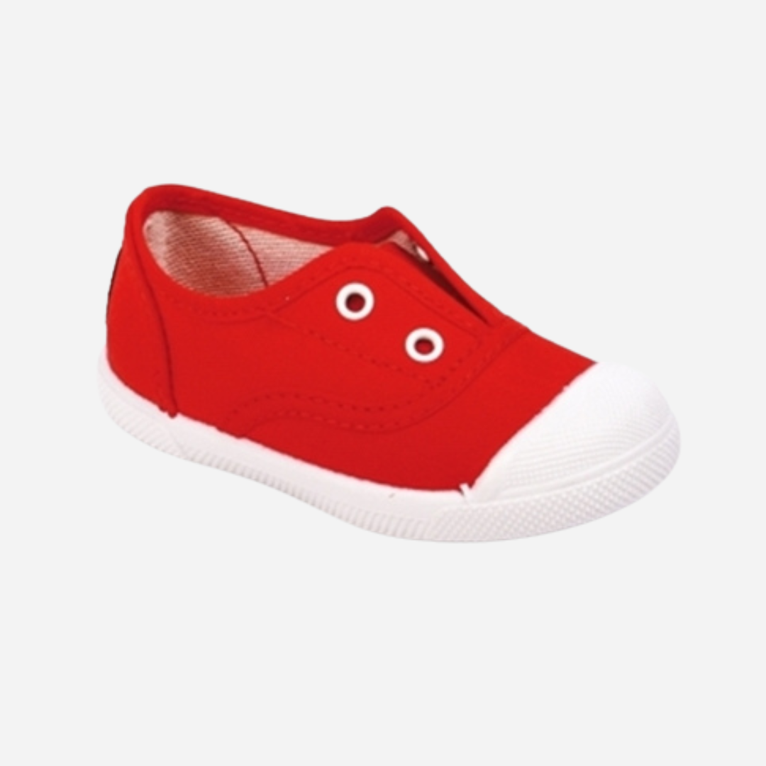 sold at Bombon shop. These canvas slip on sneakers in red are designed for play and everyday wear with a white toecap and elasticated inner, without laces. 