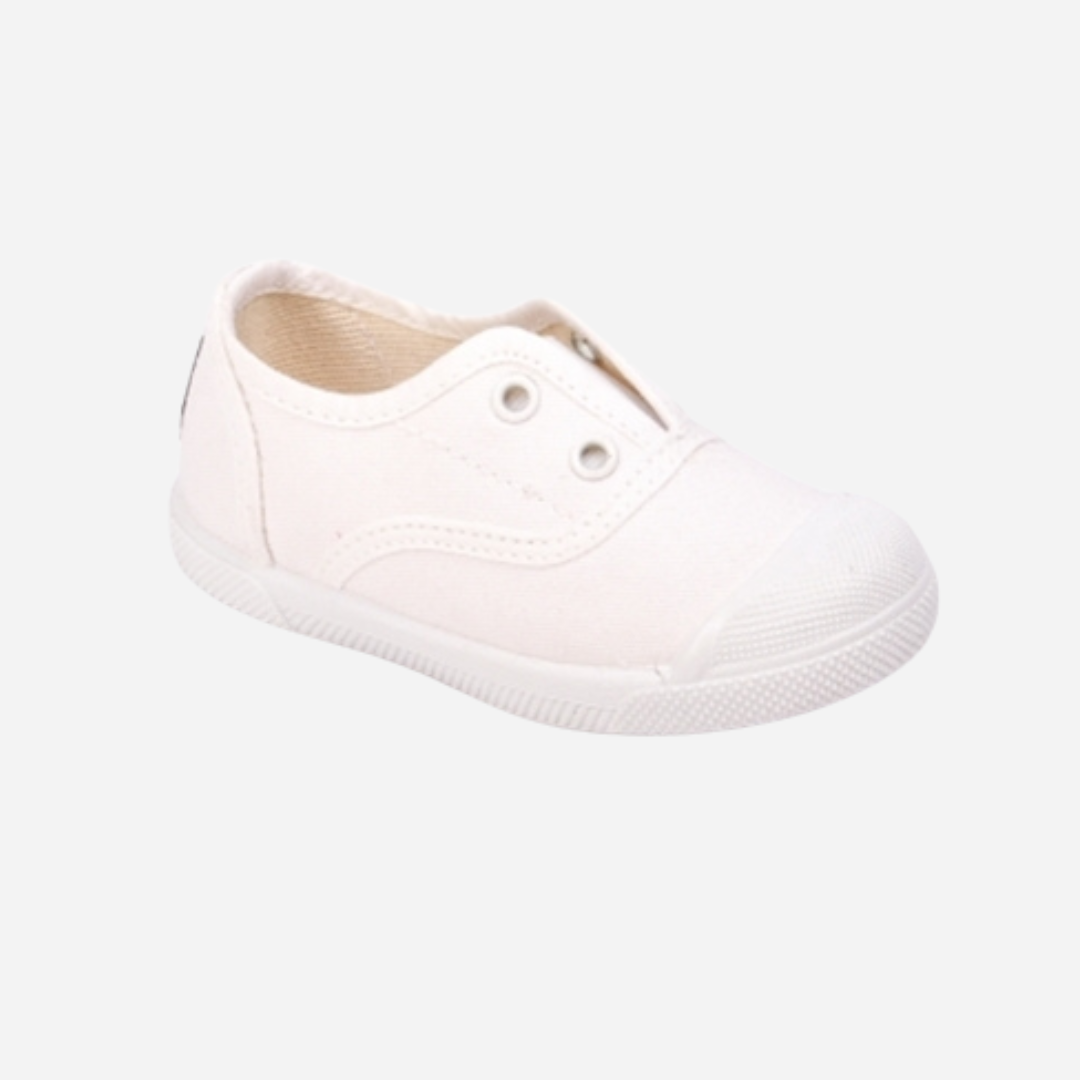 sold at Bombon shop. These canvas slip on sneakers in white are designed for play and everyday wear with a white toecap and elasticated inner, without laces. 