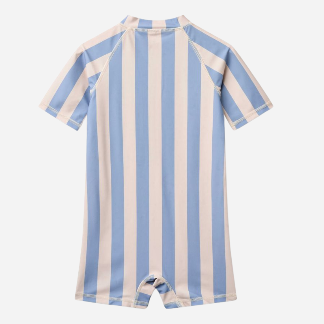 Sold at Bombon Shop, designed by Wheat, blue sky stripe short sleeve one-piece swimsuit in recycled fabric with vertical stripes and front zip closure.