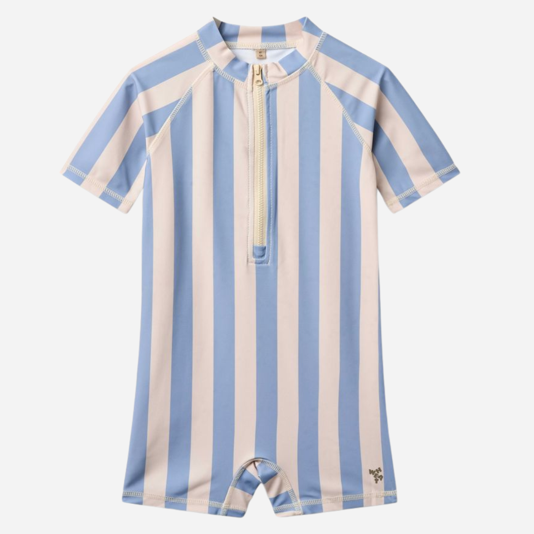 Sold at Bombon Shop, designed by Wheat, blue sky stripe short sleeve one-piece swimsuit in recycled fabric with vertical stripes and front zip closure.