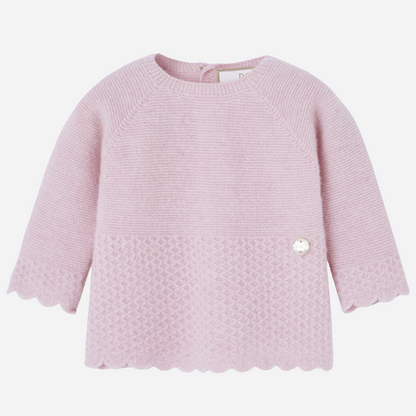 Sold at Bombon shop, designed by Paz Rodriguez, light pink knit baby top with scalloped hem and textured lower half.