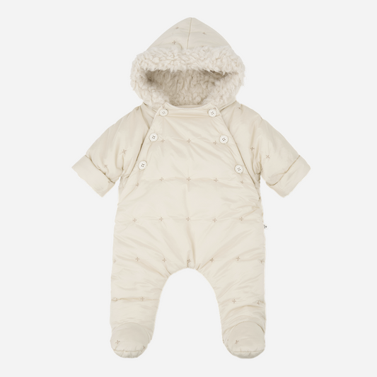 Sold at Bombon shop, designed by 1+ in the family — ecru padded baby snowsuit with star quilting, sherpa-lined hood, and front button closures, displayed flat on a white background. front