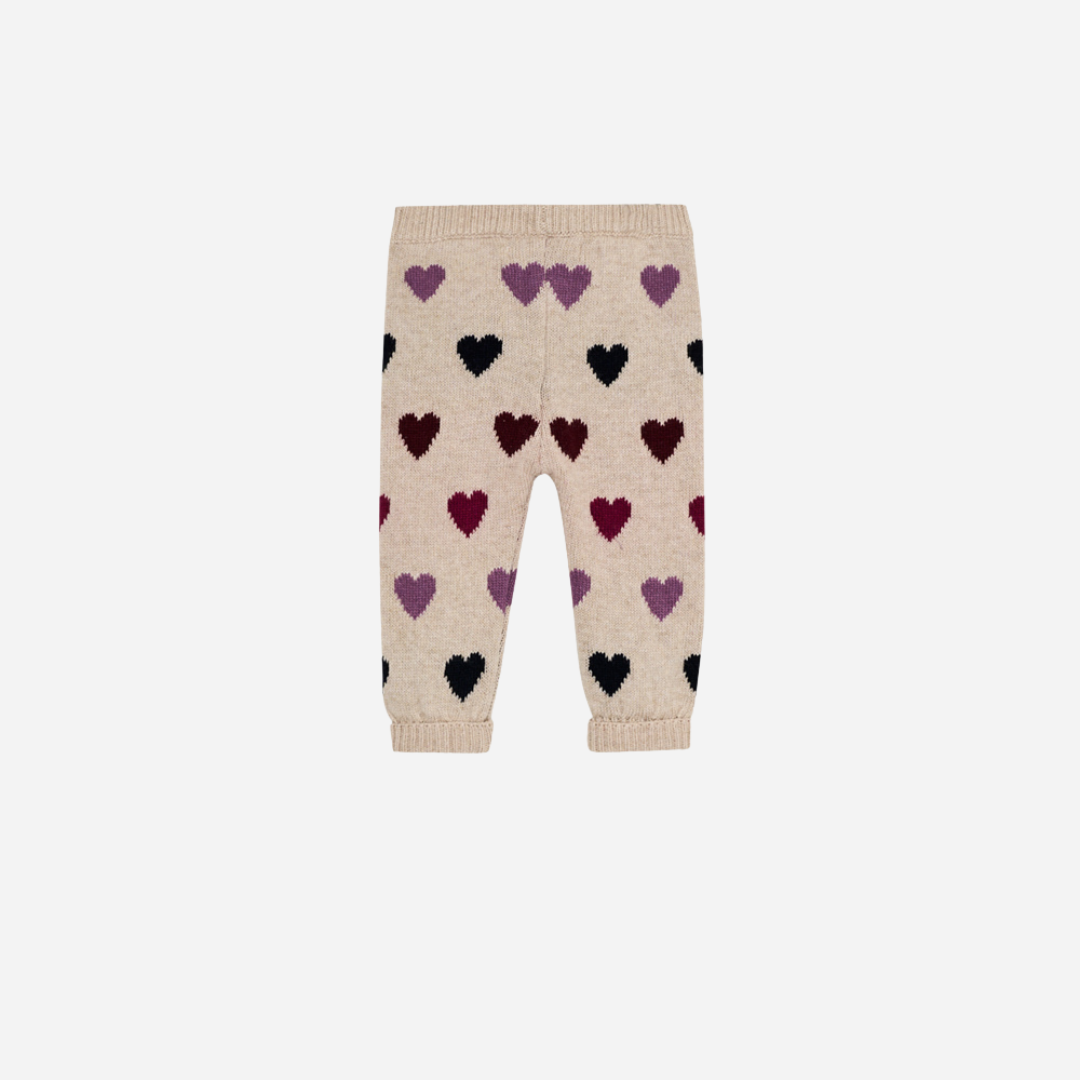Sold at Bombon Shop, these baby girl knit pants by The New Society come in a soft beige hue with an allover multicolor heart pattern and ribbed trims. back