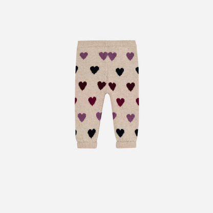 Sold at Bombon Shop, these baby girl knit pants by The New Society come in a soft beige hue with an allover multicolor heart pattern and ribbed trims. back